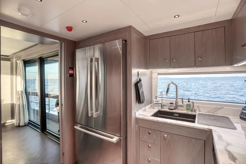 Slide: The Image of Luxurious Sirena 88 yacht kitchen with modern appliances and ocean view, 2021 model. - 40