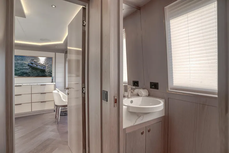 Slide: The Image of Luxurious interior of 2021 Sirena 88 yacht featuring modern bathroom and elegant living space. - 41