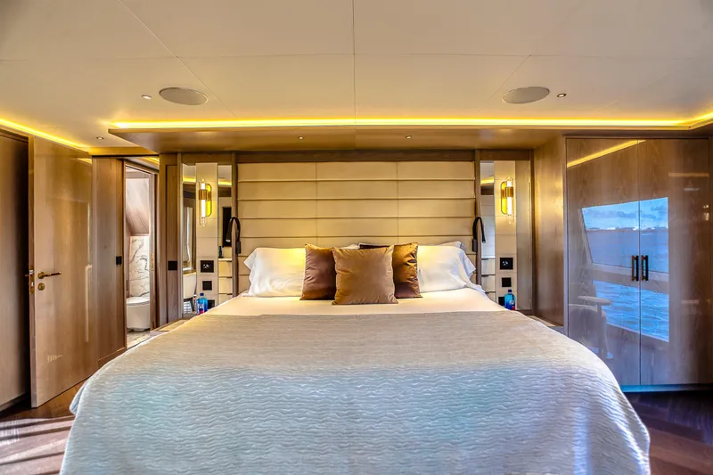 Slide: The Image of Luxurious bedroom interior of 2021 Sirena 88 yacht with elegant lighting and modern design. - 44