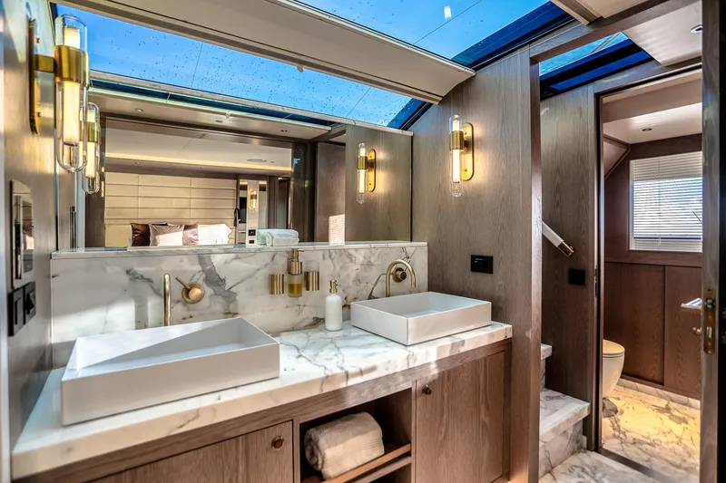 Slide: The Image of Luxurious bathroom in 2021 Sirena 88 yacht with marble countertops and modern fixtures. - 49