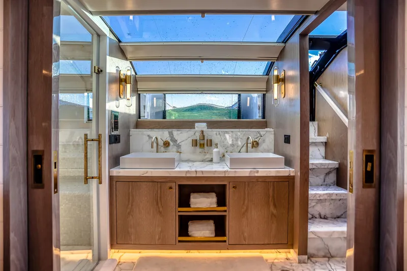 Slide: The Image of Luxurious bathroom on 2021 Sirena 88 yacht with marble finishes and modern fixtures. - 50
