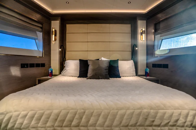 Slide: The Image of Luxurious bedroom interior of 2021 Sirena 88 yacht with elegant bedding and ambient lighting. - 55
