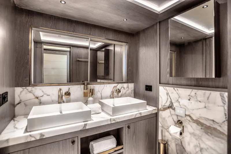 Slide: The Image of Luxurious bathroom in 2021 Sirena 88 yacht with dual sinks and marble accents. - 57