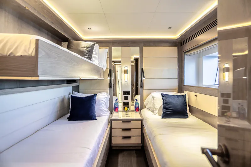 Slide: The Image of Luxurious 2021 Sirena 88 yacht cabin with modern twin beds and elegant lighting. - 60