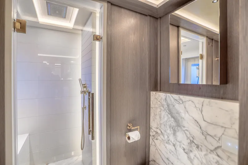 Slide: The Image of Luxurious bathroom in 2021 Sirena 88 yacht with marble accents and modern fixtures. - 61