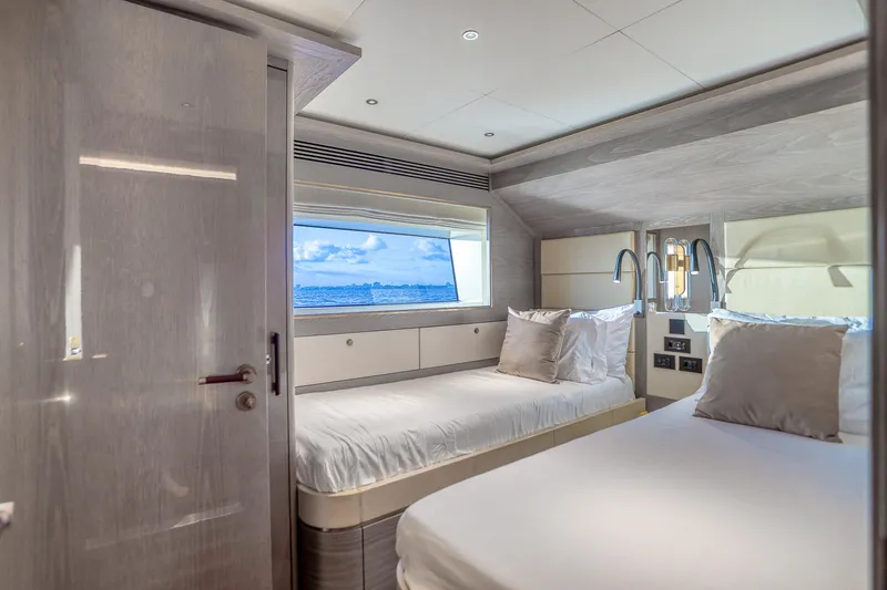 Slide: The Image of Luxurious cabin interior of 2021 Sirena 88 yacht with twin beds and ocean view. - 62