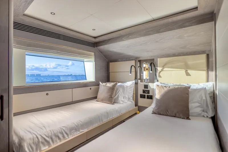 Slide: The Image of Luxurious Sirena 88 yacht bedroom interior with twin beds and ocean view, 2021 model. - 64