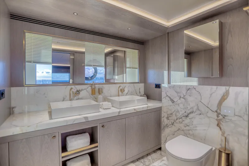 Slide: The Image of Luxurious bathroom in 2021 Sirena 88 yacht with marble accents and dual sinks. - 68