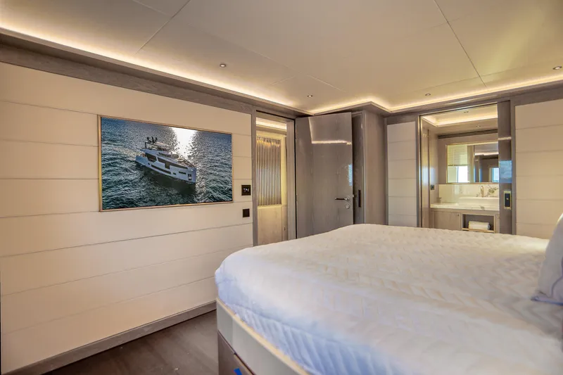 Slide: The Image of Luxurious Sirena 88 yacht bedroom interior, featuring modern design and elegant lighting, 2021 model. - 69