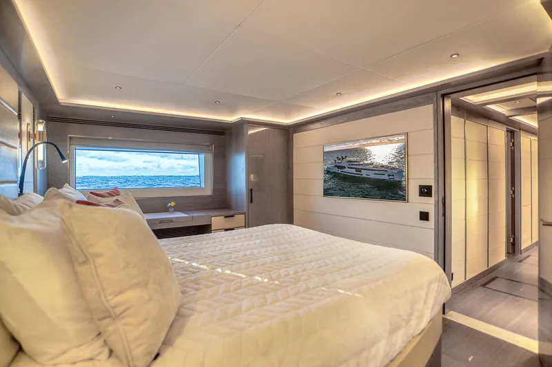 Slide: The Image of Luxurious Sirena 88 yacht bedroom interior, 2021 model, with ocean view and modern decor. - 71