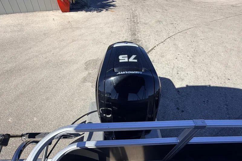 Slide: The Image of 2023 Sun Tracker Party Barge 18 DLX with Mercury 75 engine on a concrete surface. - 14