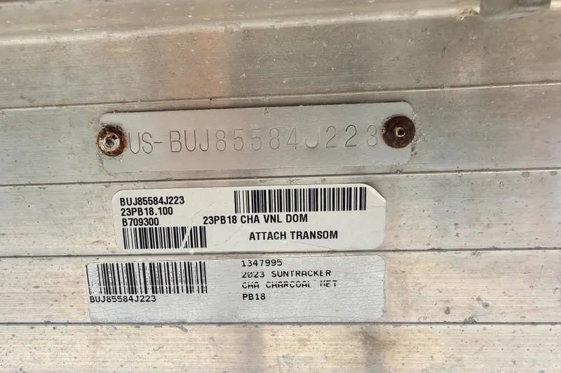 Slide: The Image of 2023 Sun Tracker Party Barge 18 DLX identification plate with serial numbers and labels. - 19