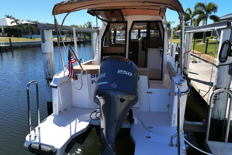 Slide: The Image of 2020 Ranger Tugs R-25 boat docked with Yamaha 250 outboard motor. - 2