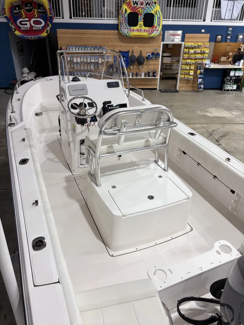 Slide: The Image of Interior view of a 2021 Edgewater 188CC boat in a showroom. - 12