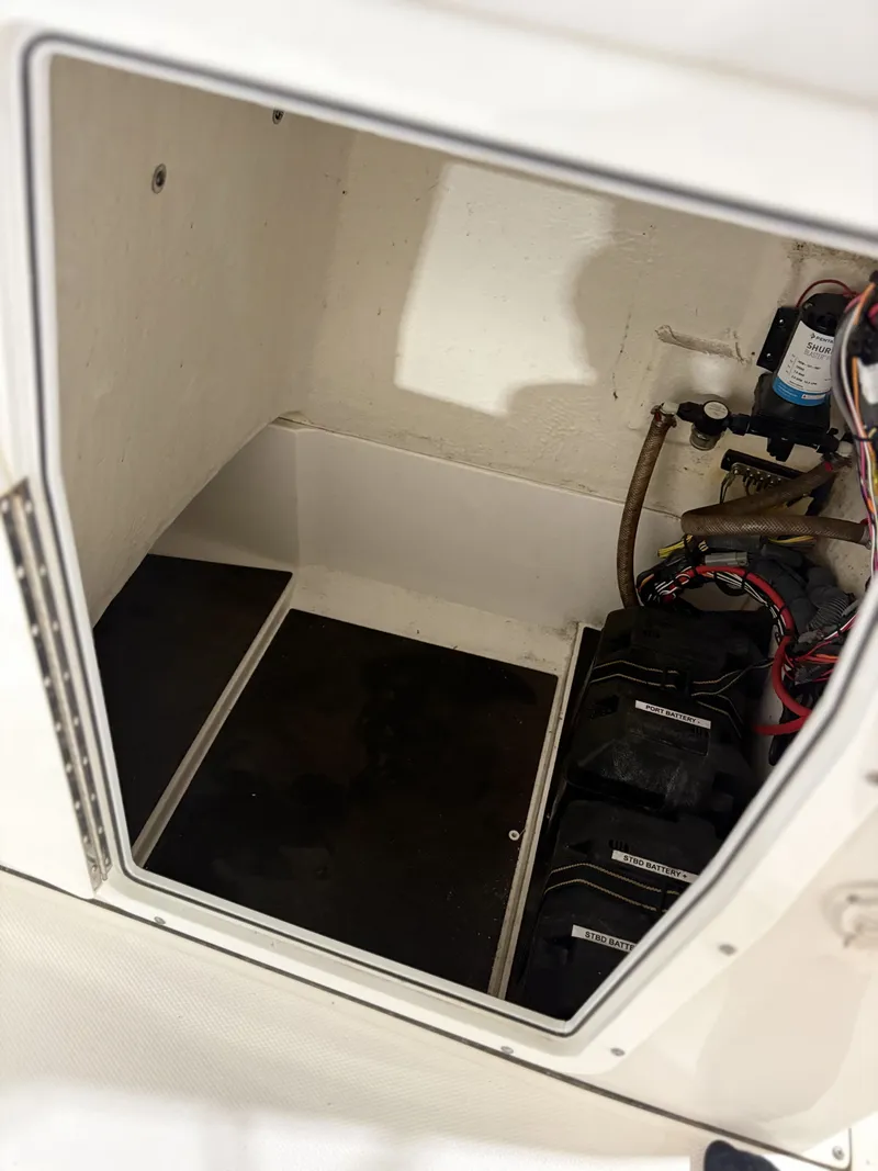 Slide: The Image of Interior of 2021 Edgewater 188CC with batteries and wiring. - 15