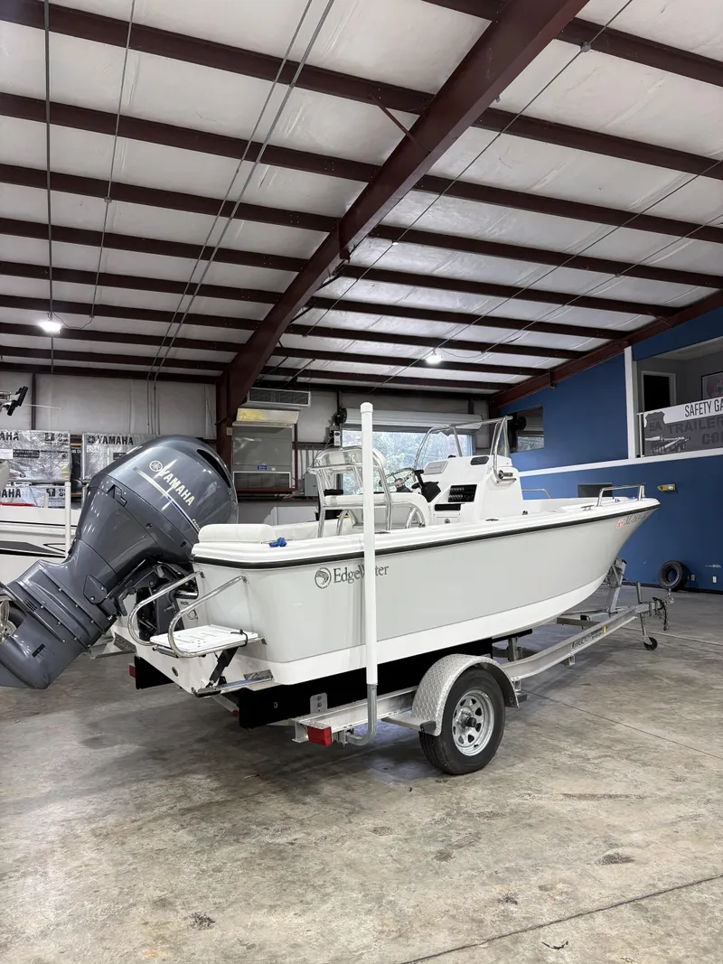 Slide: The Image of 2021 Edgewater 188CC boat on trailer in warehouse. - 8