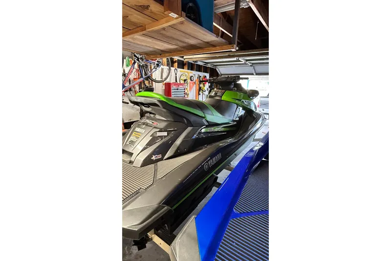 Slide: The Image of 2017 Yamaha WaveRunner FX Cruiser SVHO in a garage, showcasing sleek design and vibrant colors. - 11