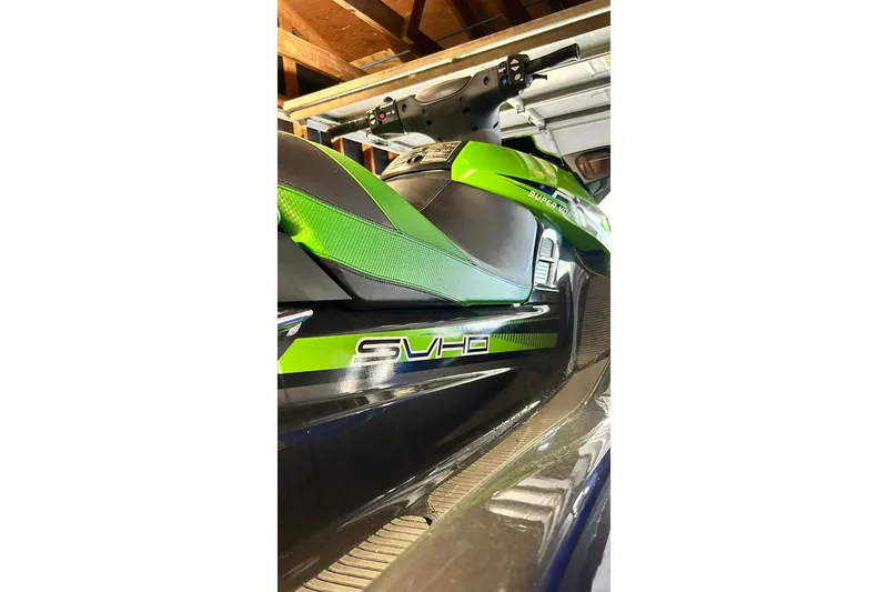 Slide: The Image of 2017 Yamaha WaveRunner FX Cruiser SVHO in a garage, featuring green and black design. - 19