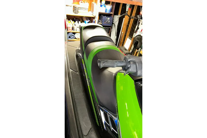 Slide: The Image of 2017 Yamaha WaveRunner FX Cruiser SVHO in a garage, featuring a sleek green and black design. - 20