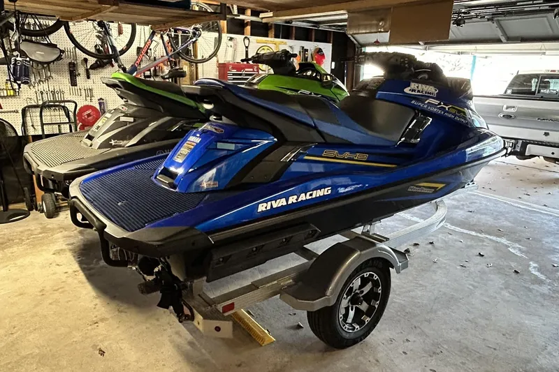 Slide: The Image of 2017 Yamaha WaveRunner FX Cruiser SVHO in garage, blue color, on trailer. - 3