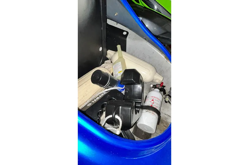 Slide: The Image of Storage compartment of 2017 Yamaha WaveRunner FX Cruiser SVHO with various items. - 30