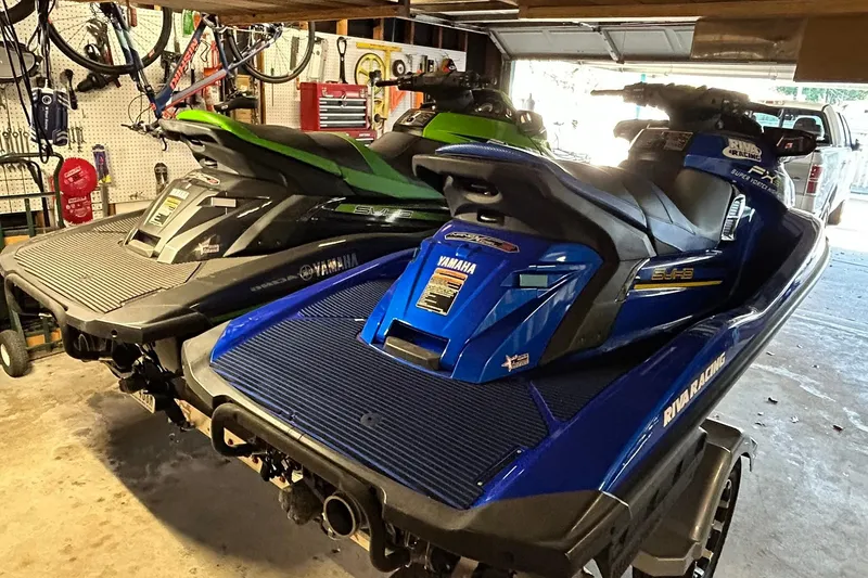 Slide: The Image of 2017 Yamaha WaveRunner FX Cruiser SVHO in garage, alongside other personal watercraft. - 4