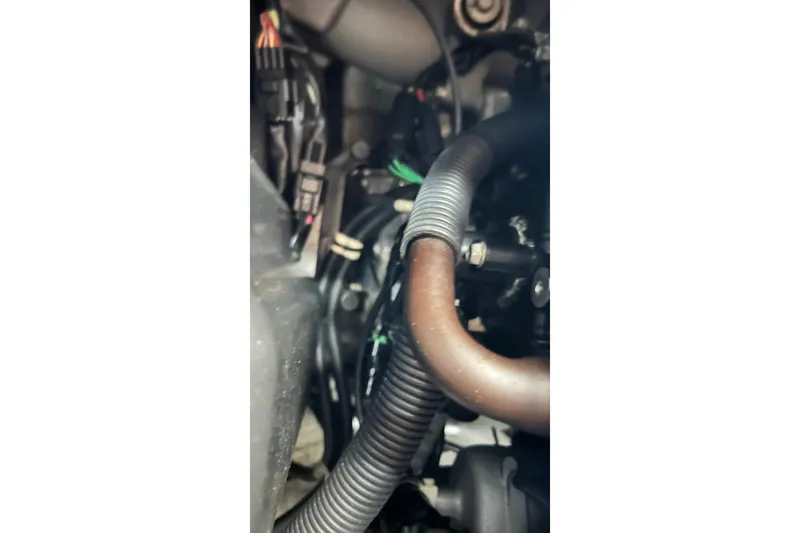 Slide: The Image of Engine components of a 2017 Yamaha WaveRunner FX Cruiser SVHO, featuring hoses and wiring. - 40