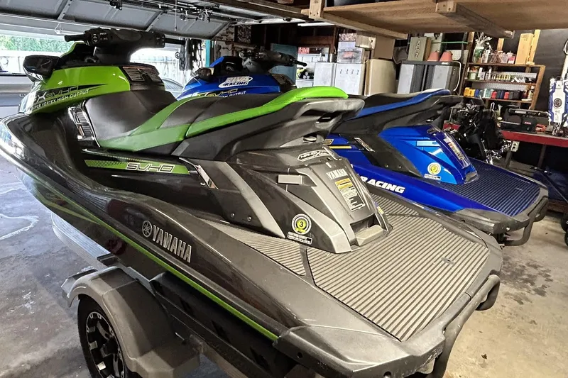 Slide: The Image of 2017 Yamaha WaveRunner FX Cruiser SVHO in garage, green and blue models. - 5