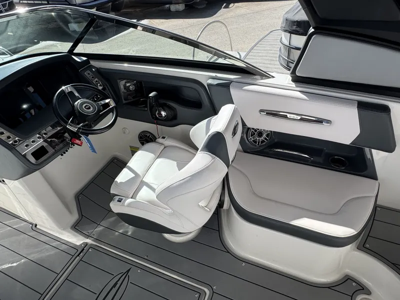 Slide: The Image of Interior of 2020 Chaparral 257 SSX with steering console. - 10