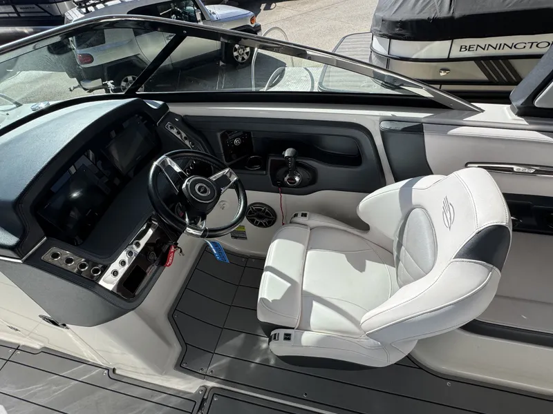 Slide: The Image of Interior of 2020 Chaparral 257 SSX with steering console and seat. - 11