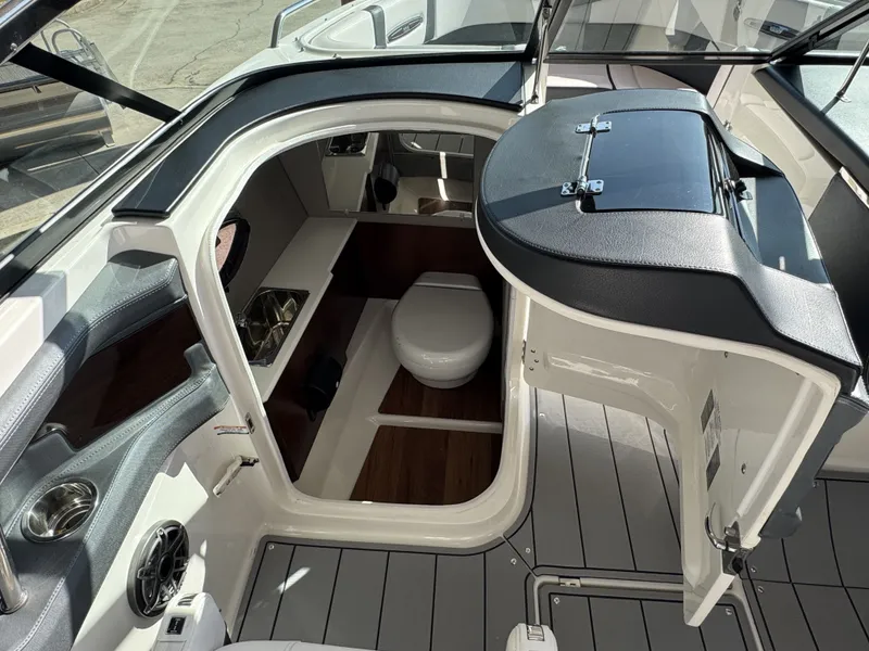 Slide: The Image of Interior of 2020 Chaparral 257 SSX with toilet and storage. - 12
