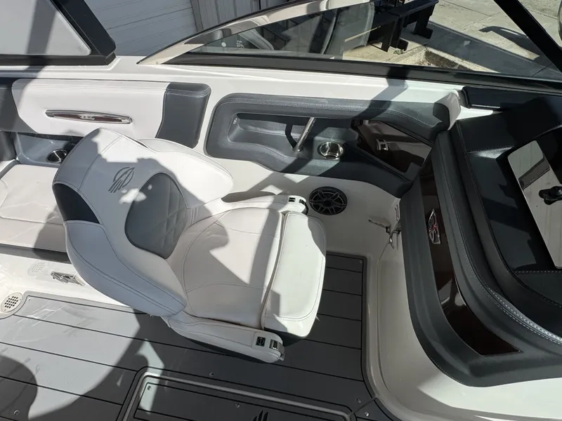 Slide: The Image of Interior of a 2020 Chaparral 257 SSX boat with white seating. - 13