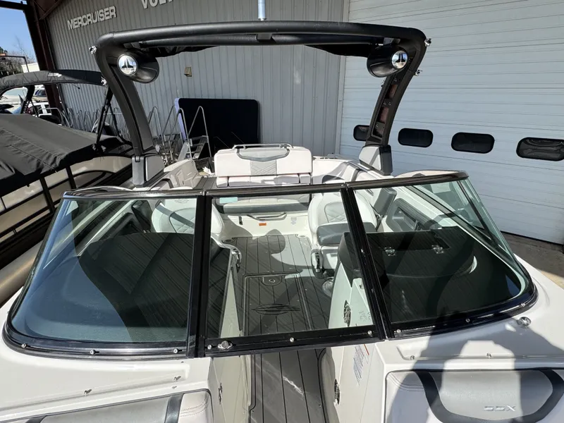 Slide: The Image of 2020 Chaparral 257 SSX boat with sleek design. - 7