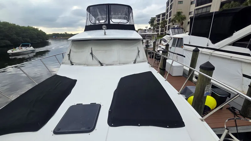 Slide: The Image of 1998 Navigator 5300 yacht docked at marina. - 11