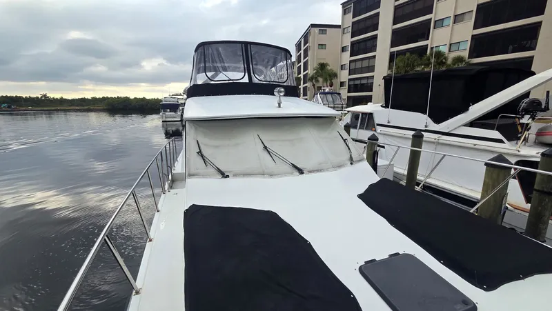 Slide: The Image of 1998 Navigator 5300 yacht docked at marina. - 12