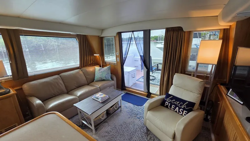 Slide: The Image of Interior of a 1998 Navigator 5300 yacht with cozy seating area. - 23