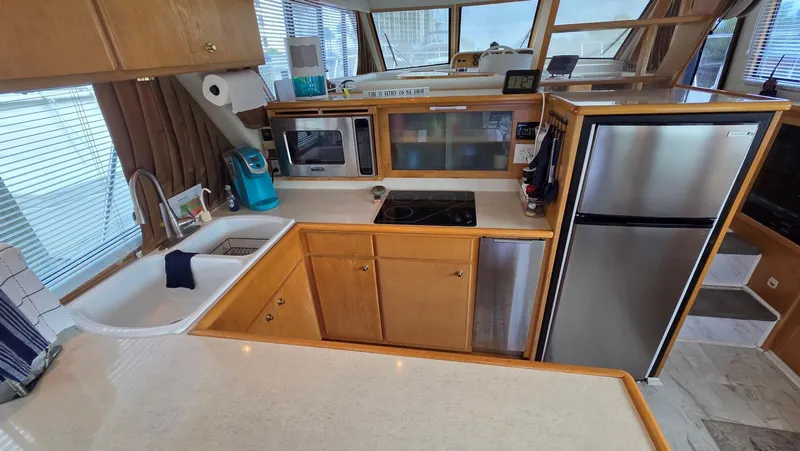 Slide: The Image of Kitchen area in a 1998 Navigator 5300 yacht. - 26