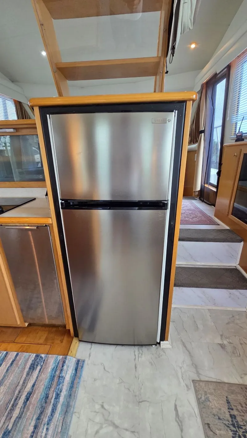 Slide: The Image of Compact refrigerator in a 1998 Navigator 5300 yacht interior. - 27