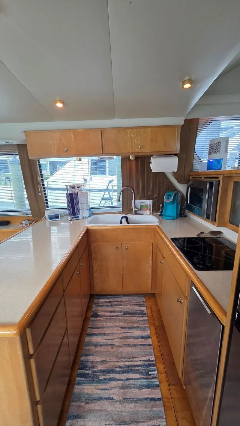 Slide: The Image of Kitchen area in a 1998 Navigator 5300 yacht. - 28