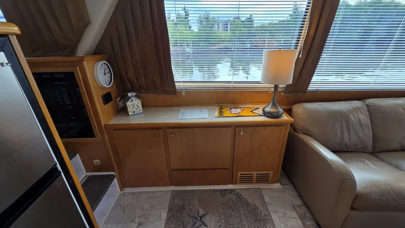 Slide: The Image of Interior of a 1998 Navigator 5300 yacht with sofa and lamp. - 32