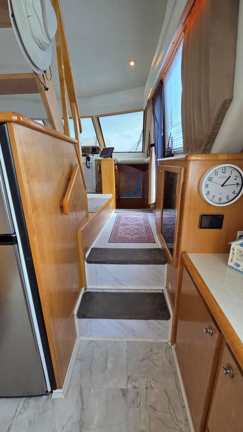Slide: The Image of Interior of a 1998 Navigator 5300 yacht with stairs and clock. - 34