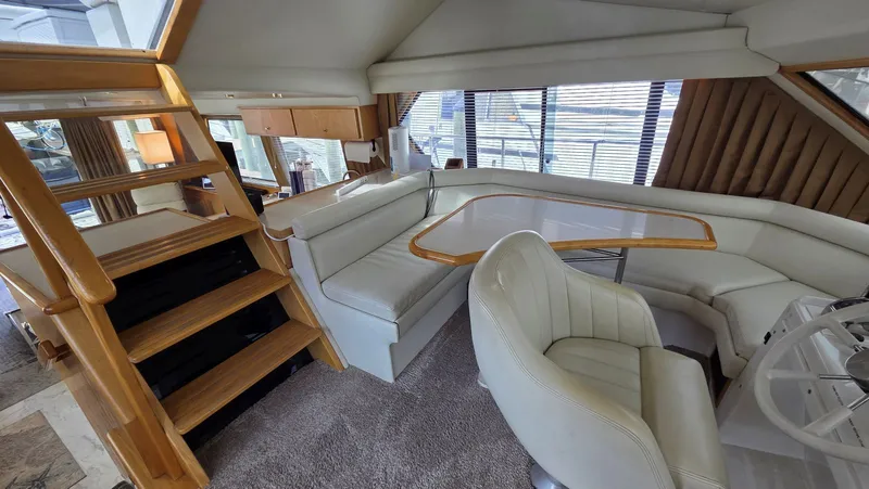 Slide: The Image of Interior of a 1998 Navigator 5300 yacht with elegant seating area. - 38