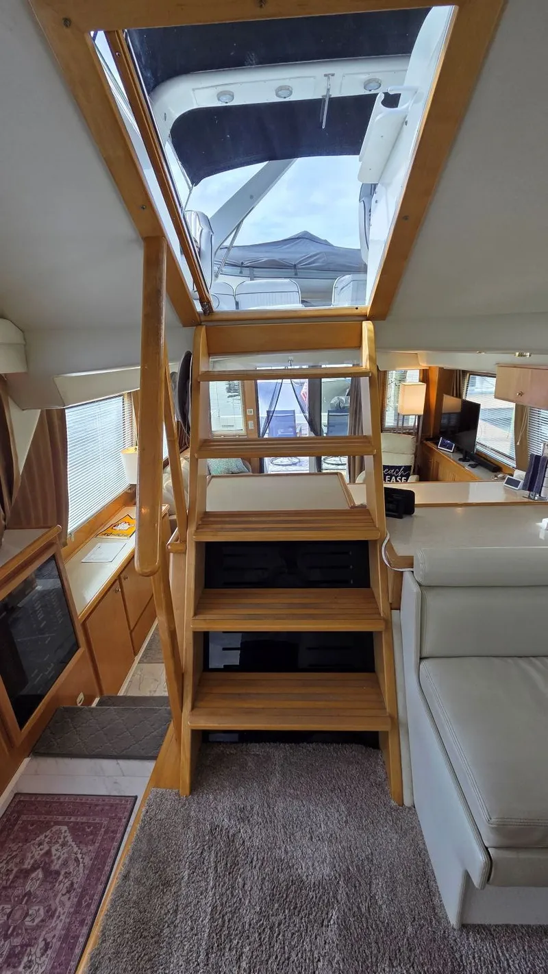 Slide: The Image of Interior of a 1998 Navigator 5300 yacht with wooden staircase. - 39