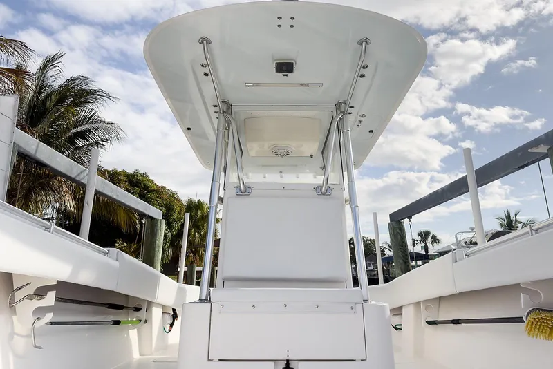 Slide: The Image of 2007 Invincible 33 Open Fisherman boat interior with T-top and rod holders. - 12
