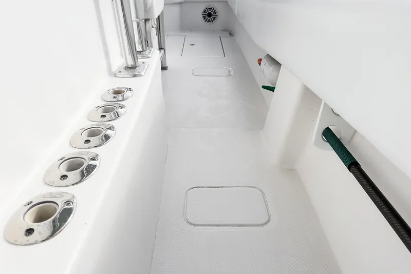 Slide: The Image of 2007 Invincible 33 Open Fisherman boat interior with rod holders and clean deck. - 15