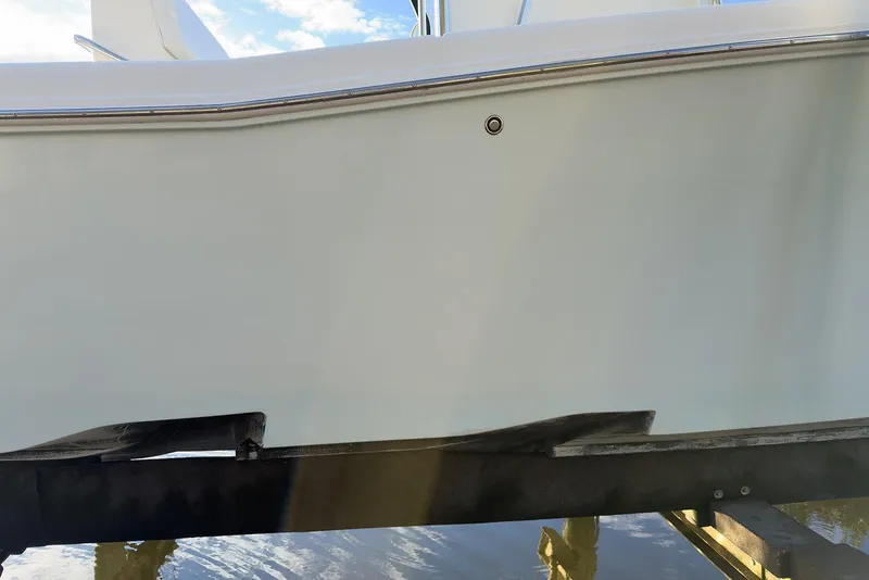 Slide: The Image of 2007 Invincible 33 Open Fisherman boat hull on a lift, side view. - 18