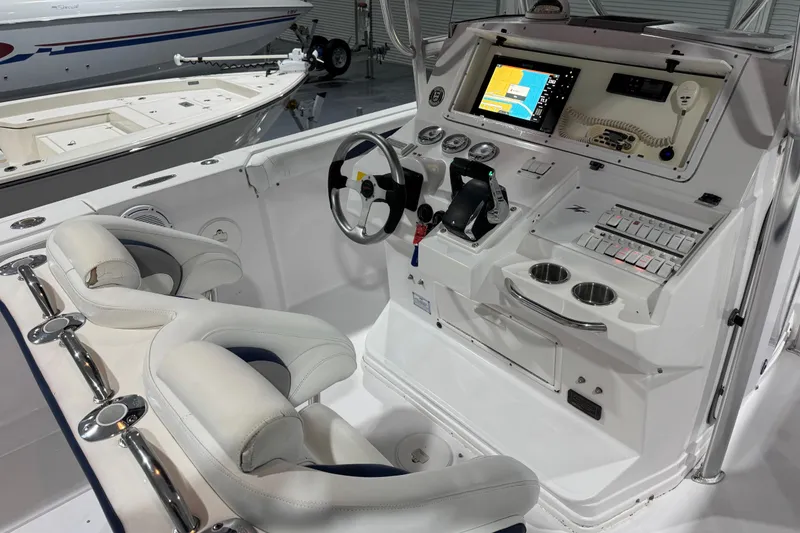 Slide: The Image of 2005 Donzi 32 ZF Open boat cockpit with modern controls and navigation system. - 12