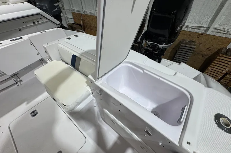 Slide: The Image of 2005 Donzi 32 ZF Open boat interior with open storage compartment and seating. - 21