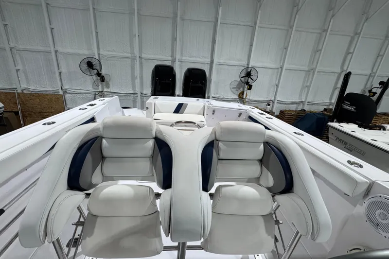 Slide: The Image of 2005 Donzi 32 ZF Open boat interior with dual cushioned seats in a spacious cabin. - 26