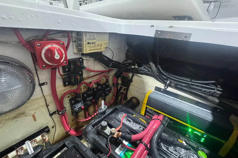 Slide: The Image of Electrical system of a 2005 Donzi 32 ZF Open boat, featuring wiring and battery setup. - 27